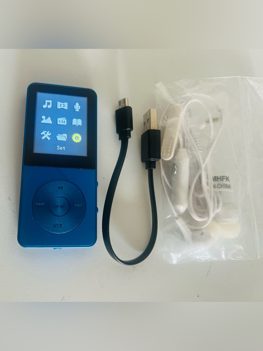 Compact Blue MP3 Player with USB Cable and Earbuds in Working Perfectly Like New